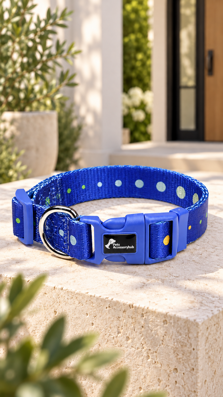 Blue dotted collar with blue buckle and black PetsAccessoryHub logo badge, shown as a design visualization