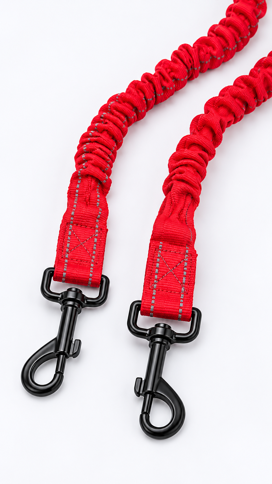 Red dual dog bungee leash arranged on a pet shop counter with a loop handle and two branches